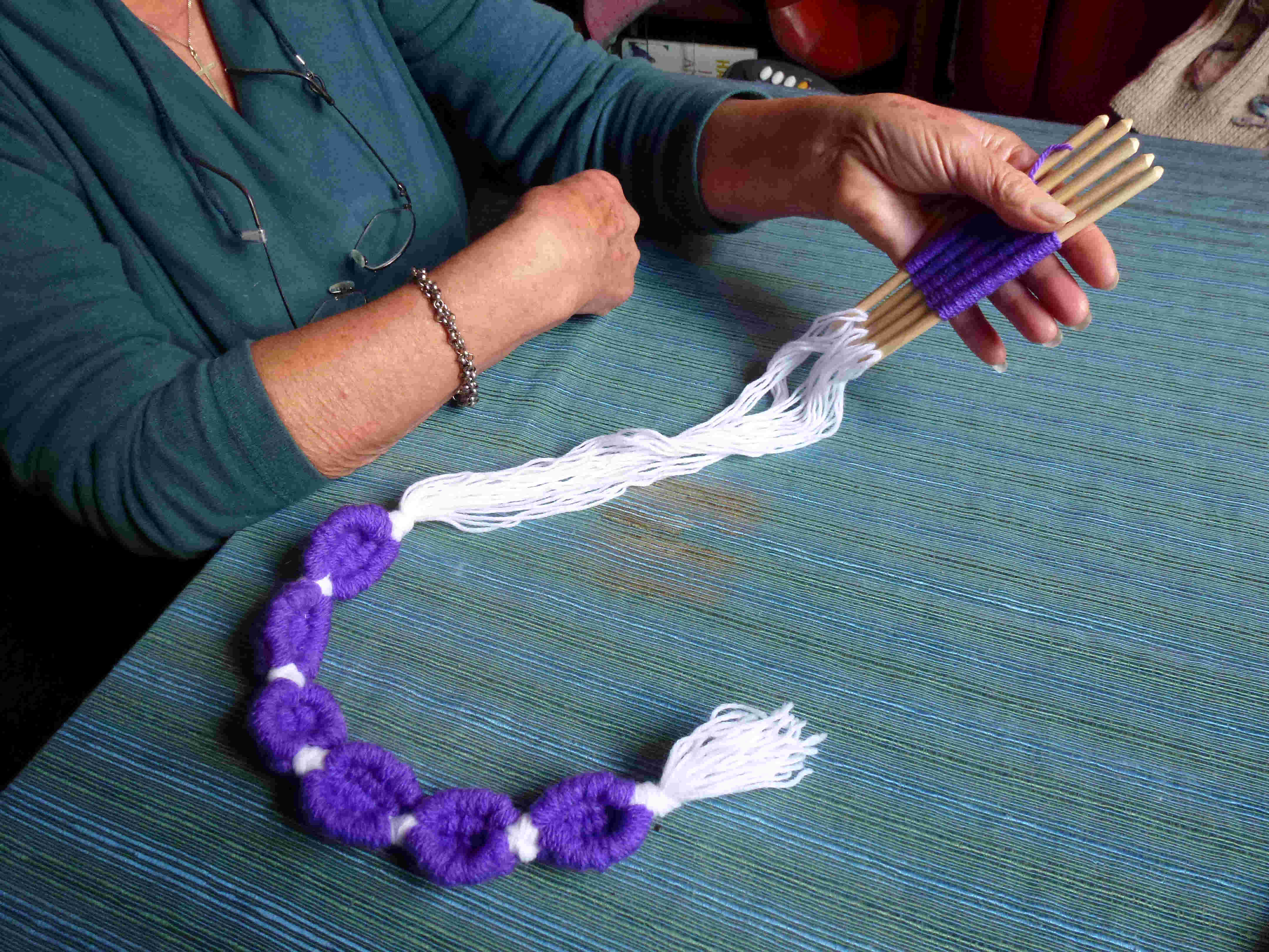 textile jewelry made with weaving sticks